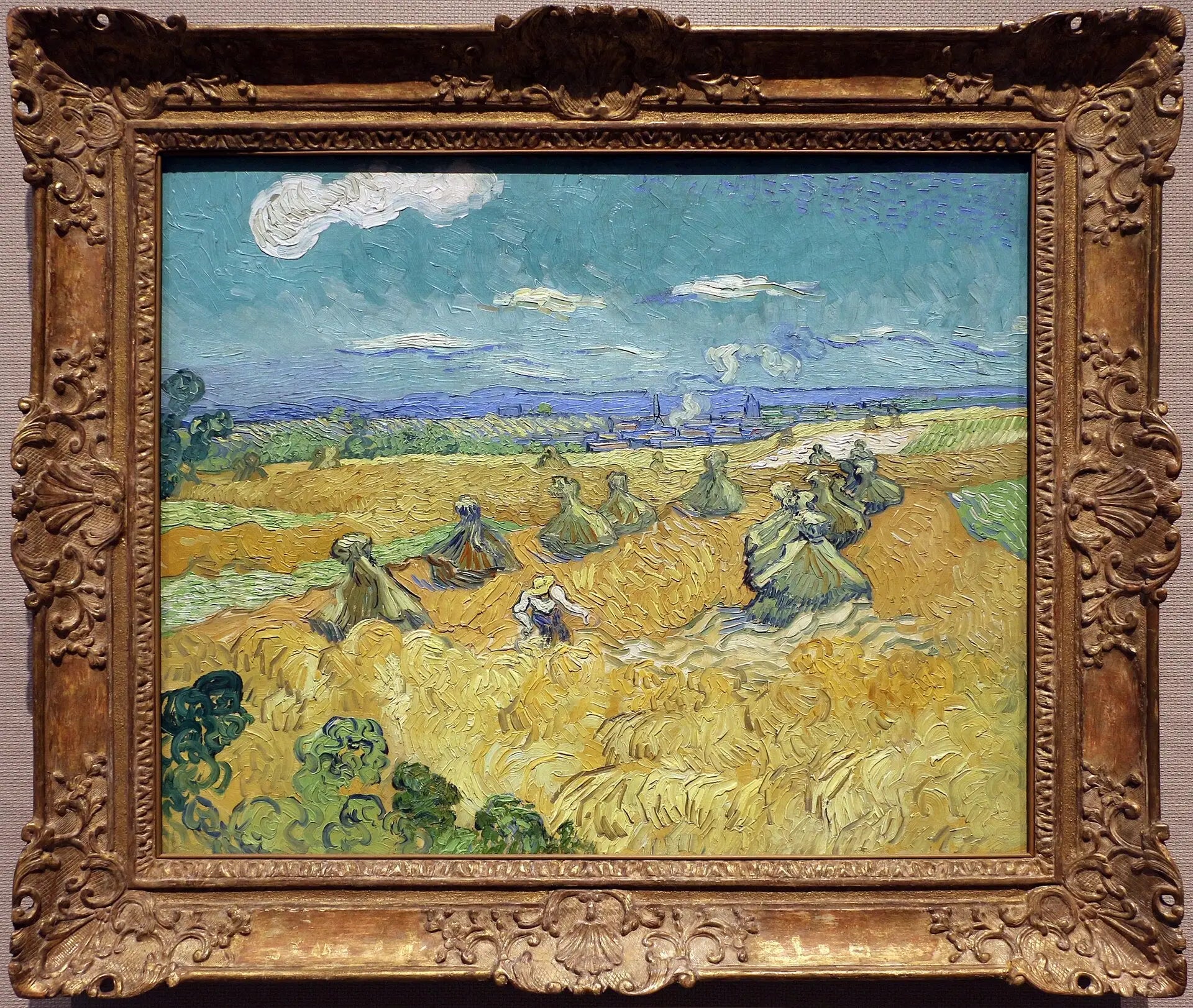 Reproduction du tableau « Champ de blé avec gerbes et moissonneuse - Vincent van Gogh » par Alpha Reproduction en peinture à l’huile