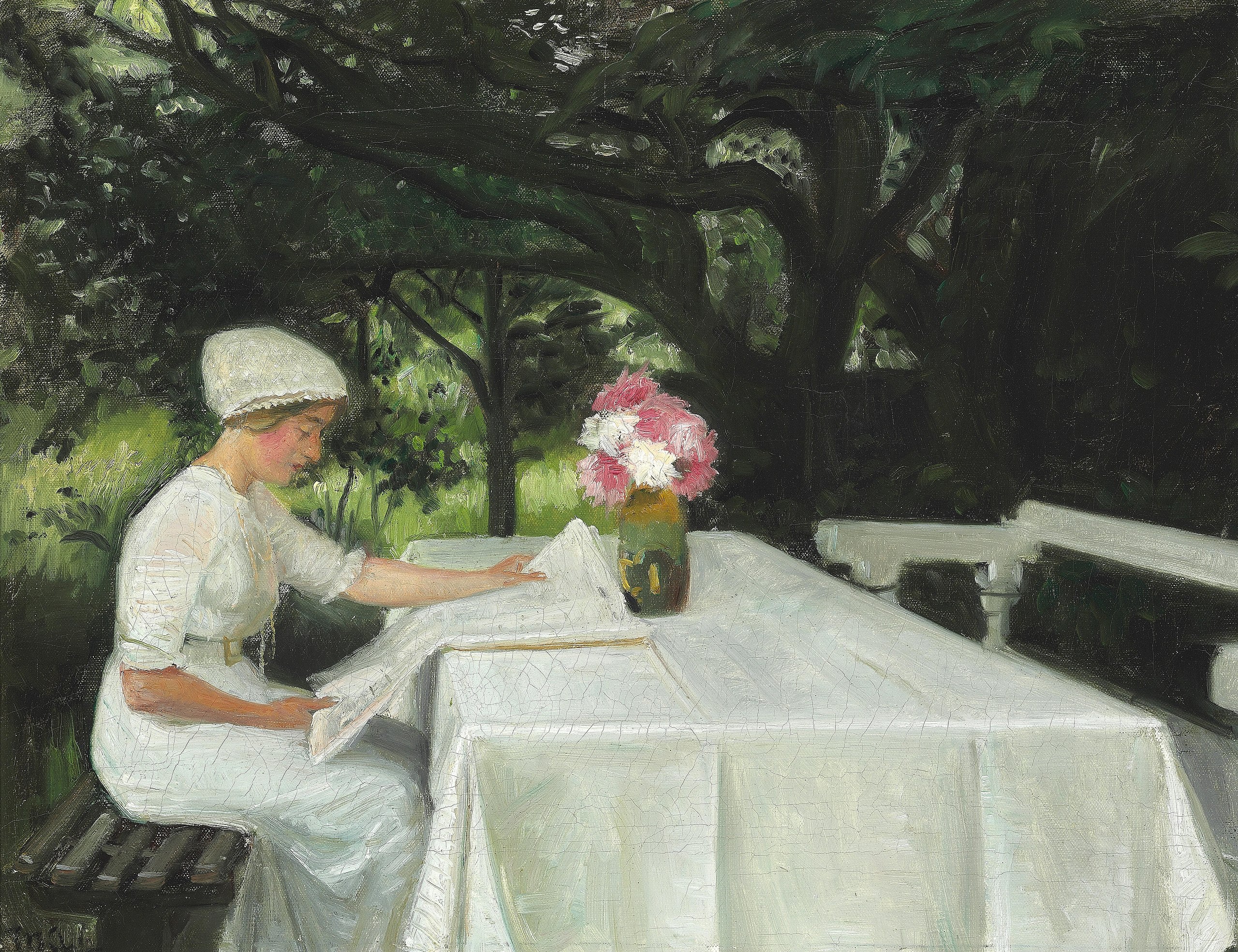 Dans un jardin de Skagen. Une jeune femme lit un journal. - Michael Peter Ancher